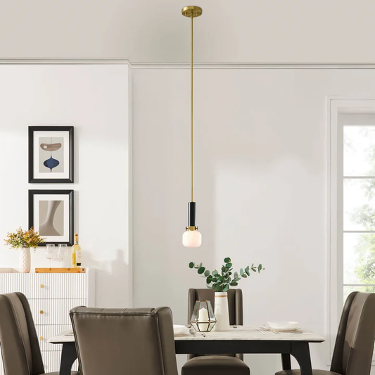 Modern pendant lamp hanging over a dining table