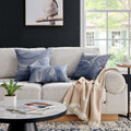 Elegant Erling Pillows styled on a cozy beige sofa, enhancing the decor with their sophisticated blue and white abstract pattern.