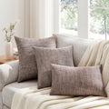 Elegant Handleman Pillow on beige sofa with modern art decor