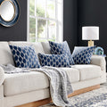 Luxurious Lottolini Pillow styled on a contemporary beige sofa, featuring a bold navy wave pattern that adds a sophisticated and modern touch to the living room decor.