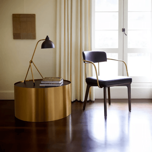 Elegant Gil coffee table paired with a black chair